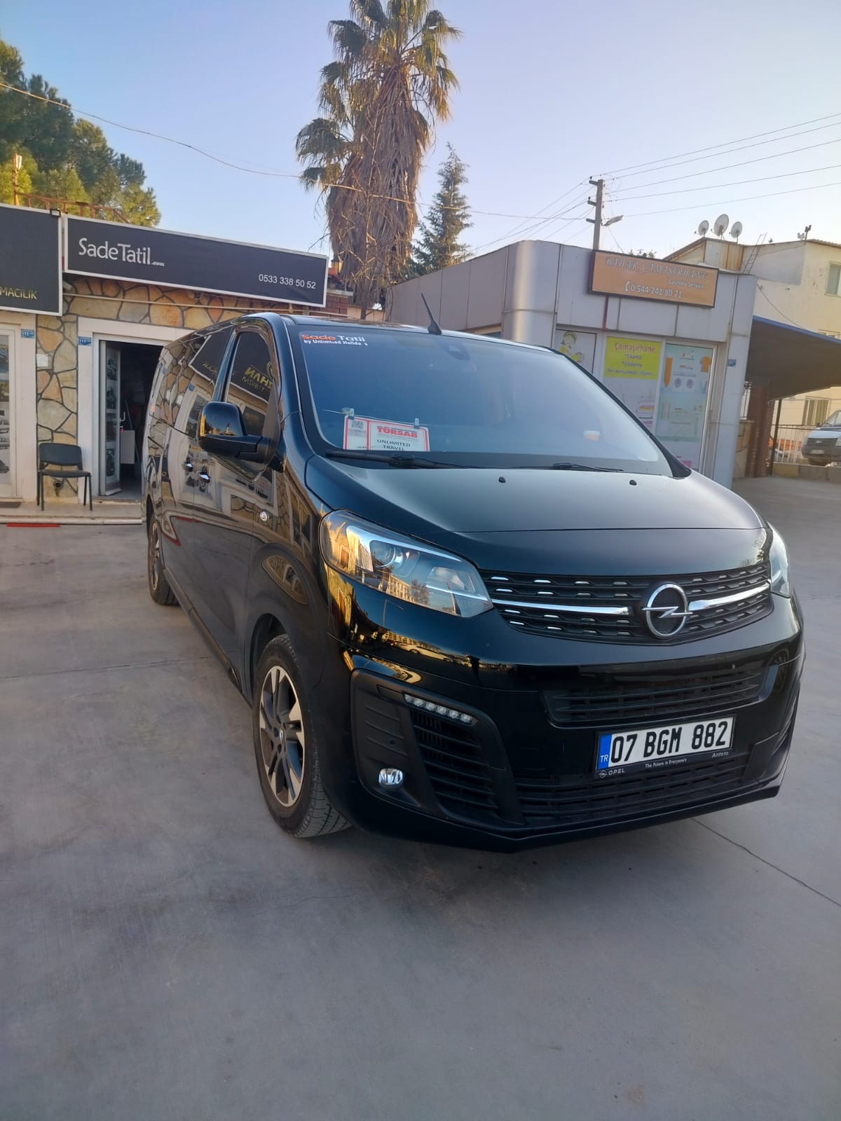 Unlimited Holidays transfer vehicle in front of Kalkan office
